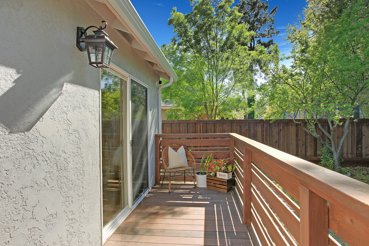 The deck, with a shaded bench