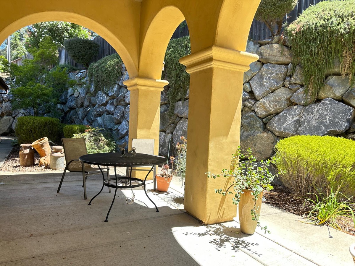 The arched patio and garden at The Villa